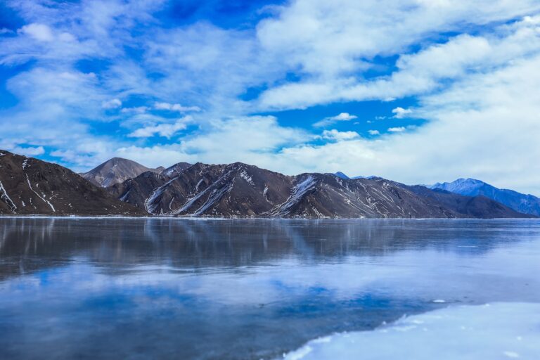 a large body of water surrounded by mountains